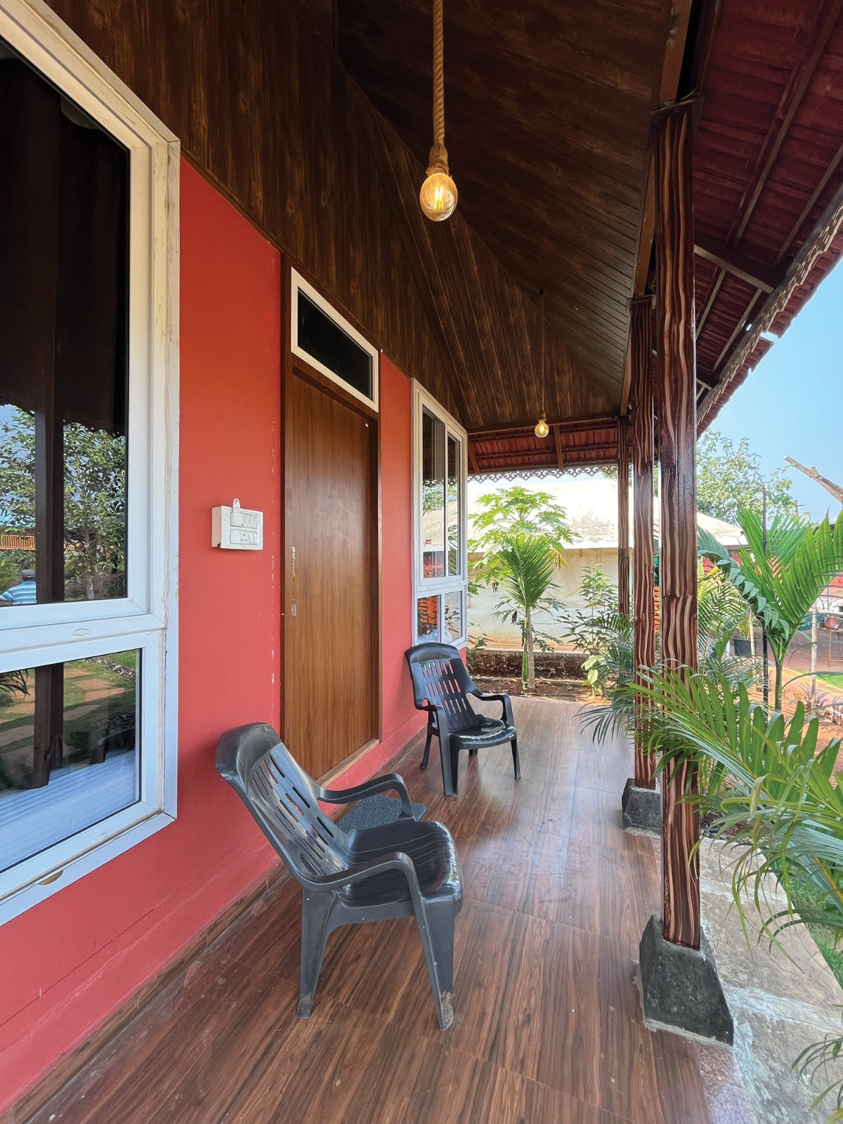 Hut veranda with garden view at Mitraay Resort