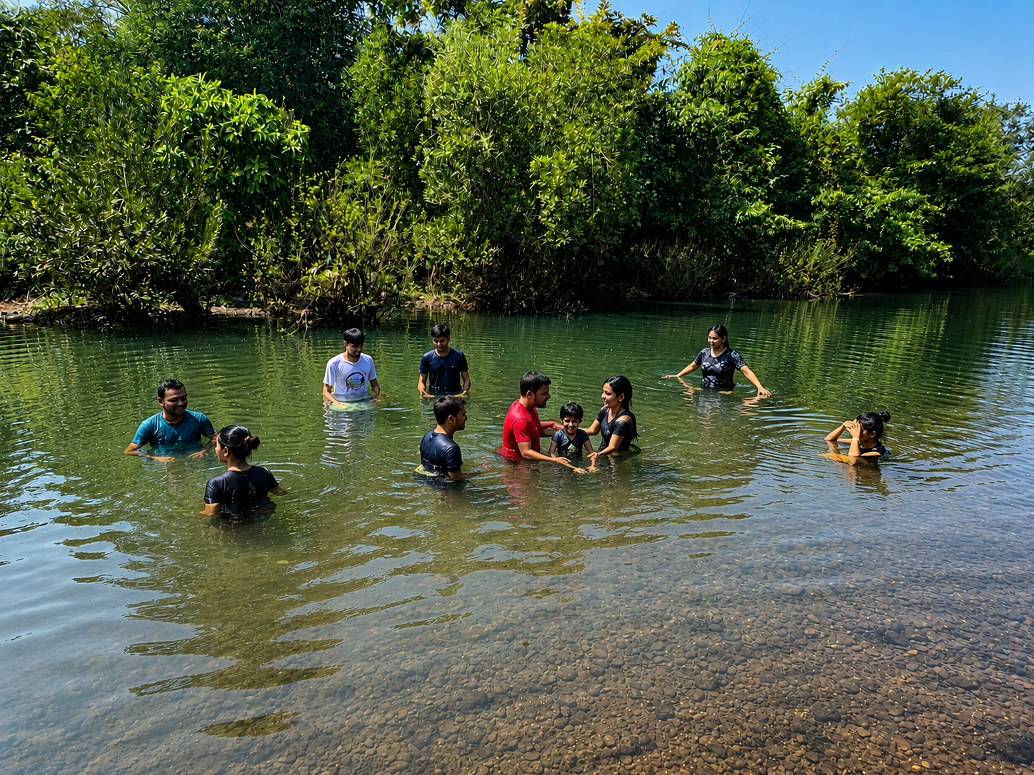 Group swimming in the river near Mitraay Resort