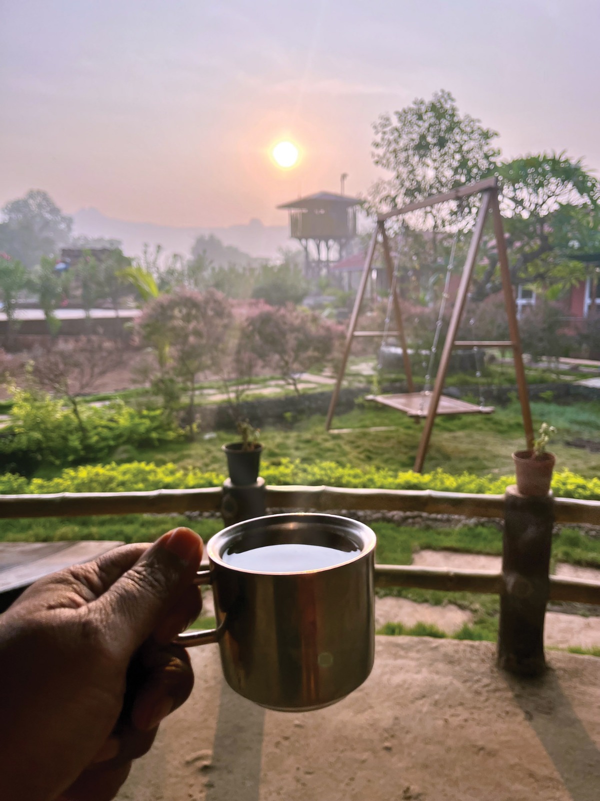 Morning chai with treehouse and sunrise view at Mitraay Resort