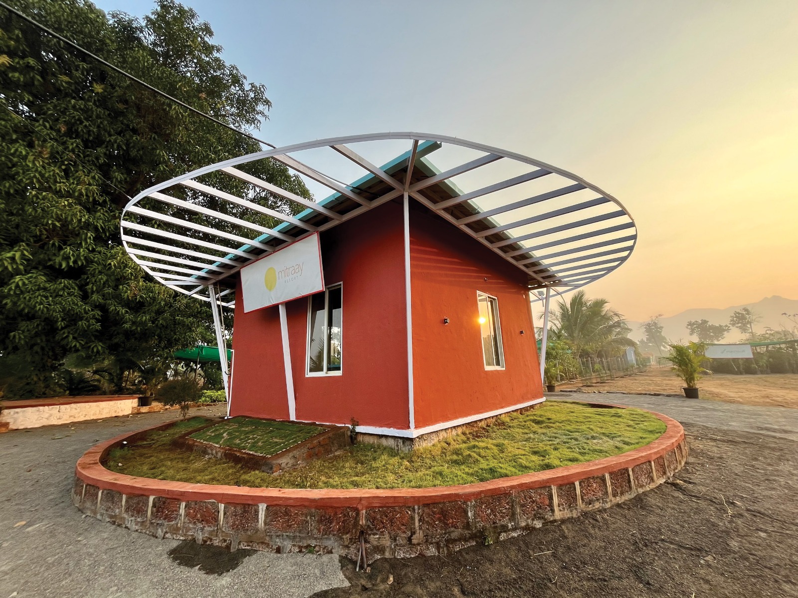 Entrance of Mitraay Agro Resort at sunset