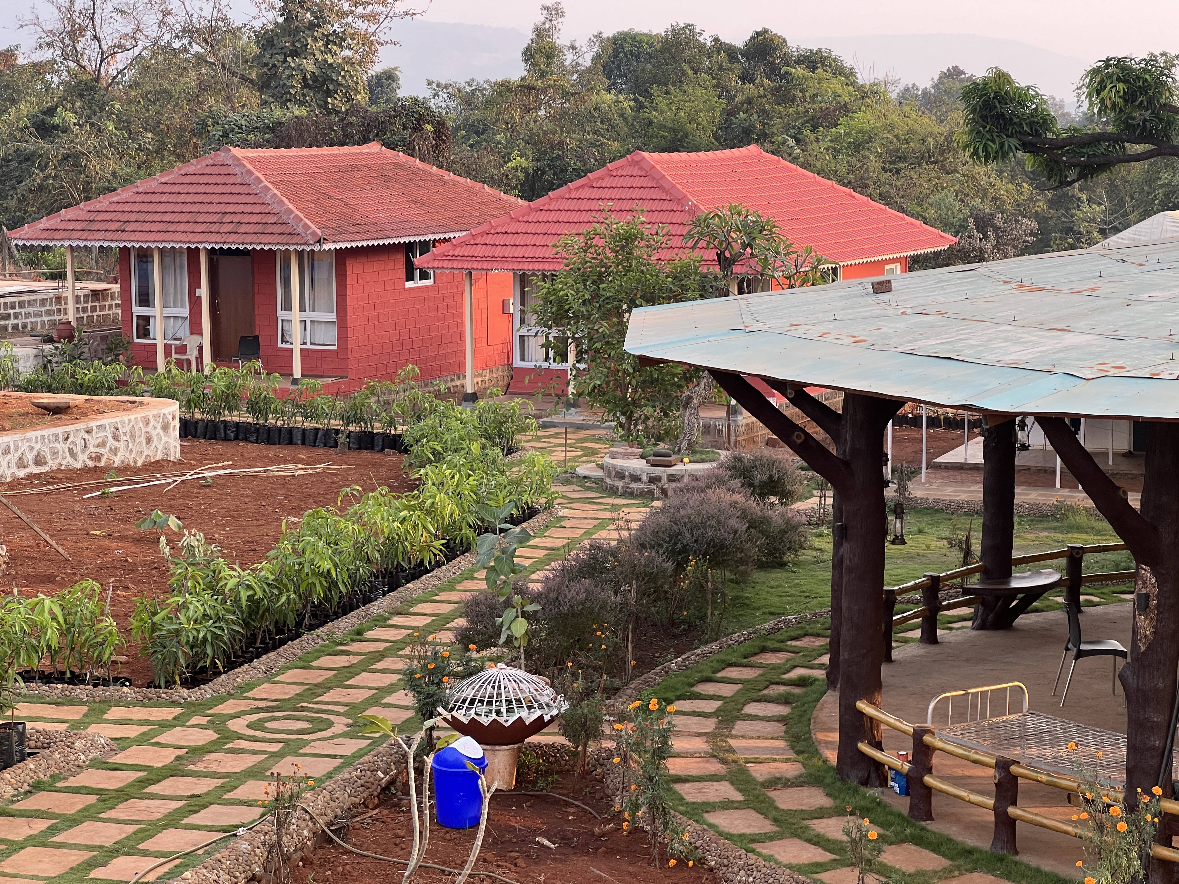 Garden path between stone huts at Mitraay Resort