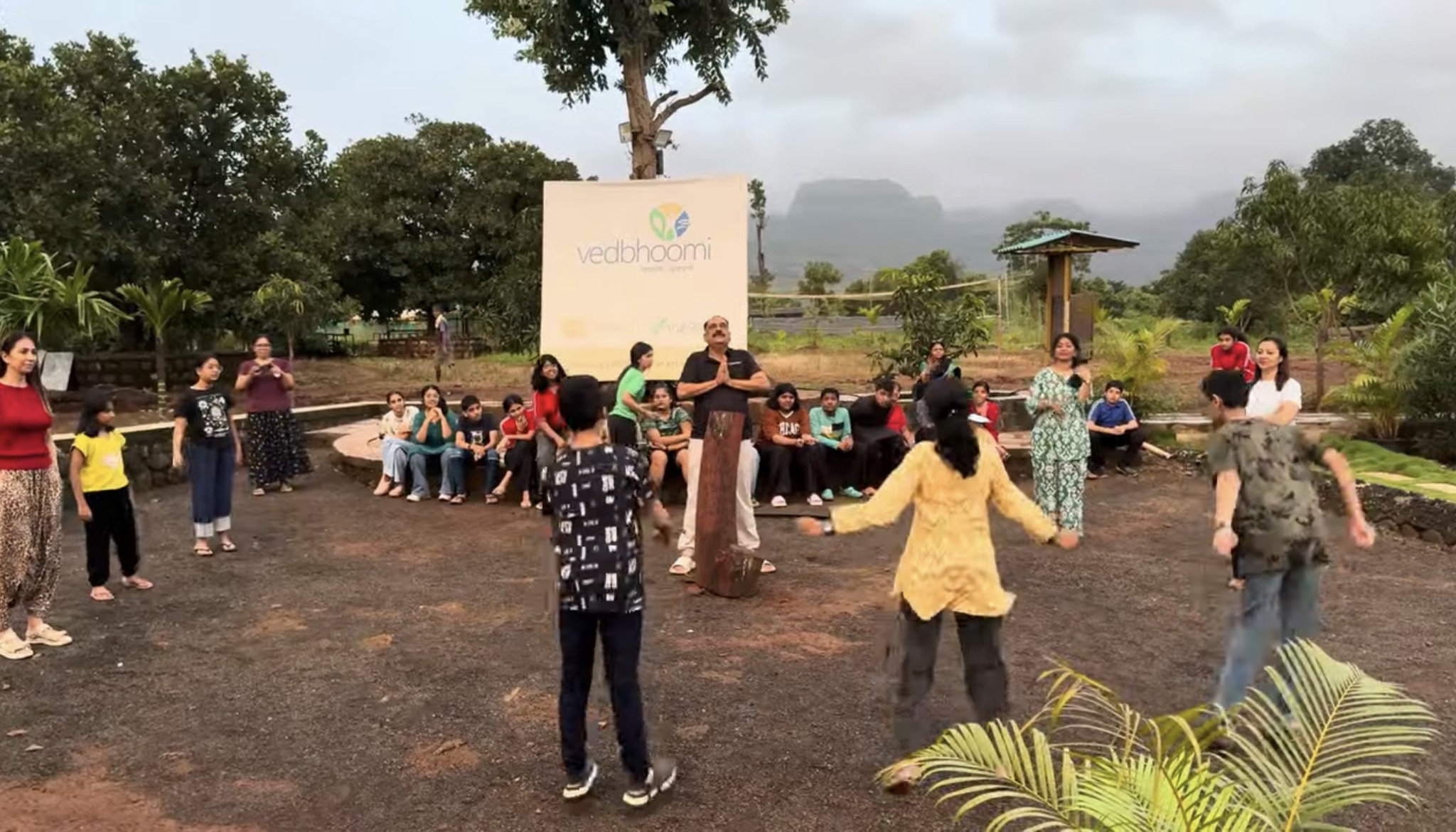 School kids in a learning activity circle at Mitraay Resort